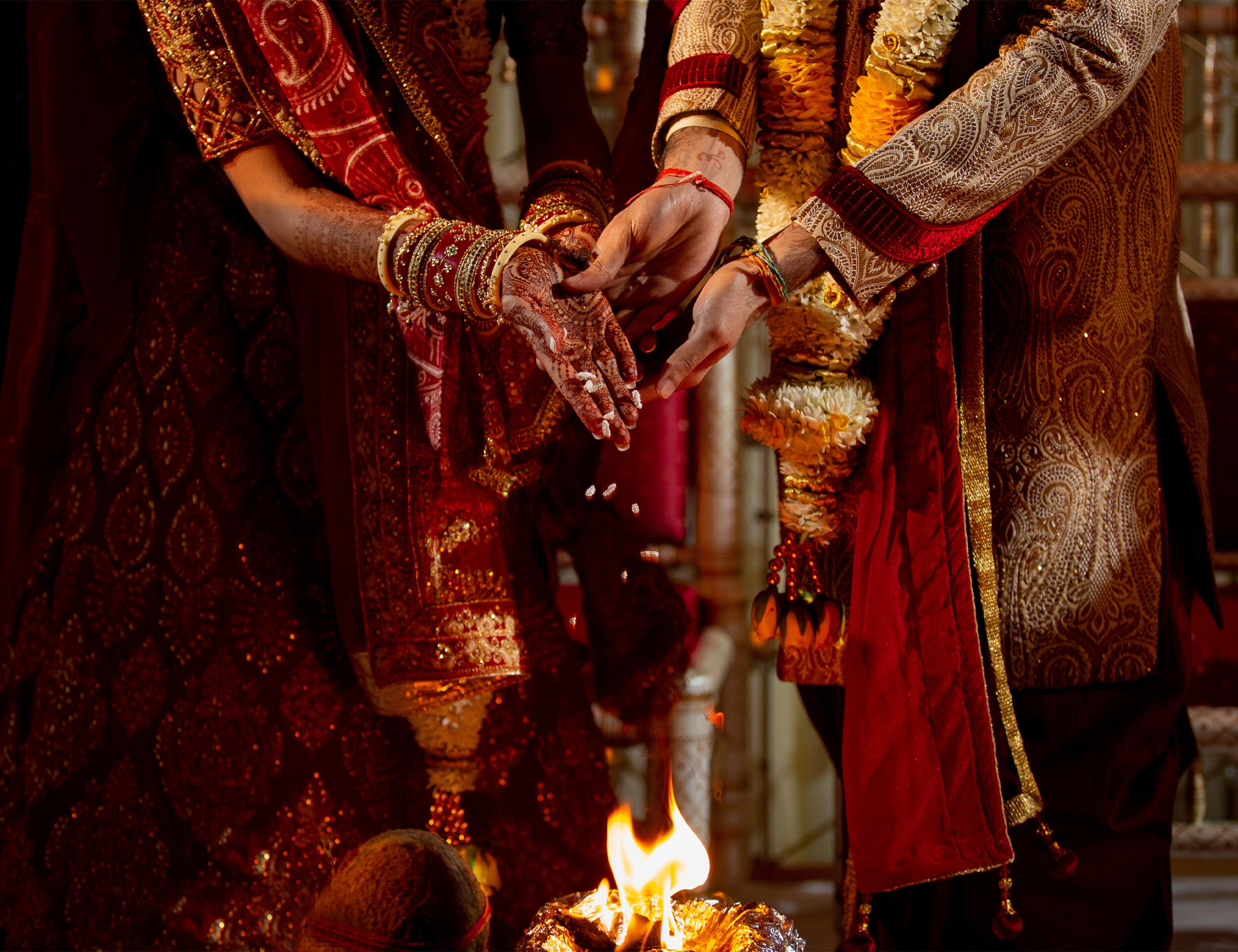 A bride and groom doing 7 vows rituals on their wedding